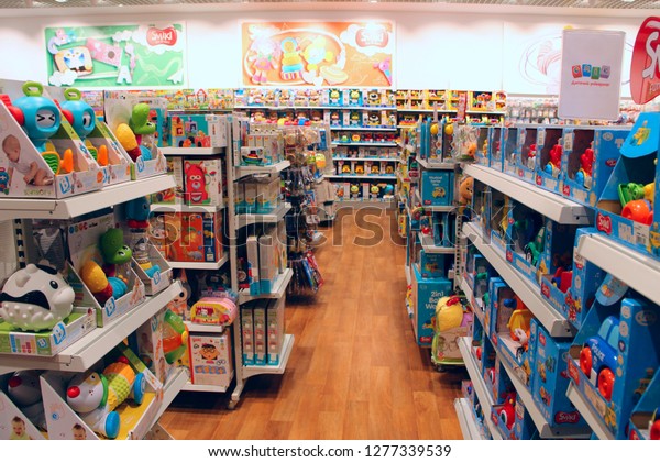 Kyiv / Ukraine. 28 September 2018: Shop toys. Toy\
store. Inside toy shop. Rows of shelves with toys. Children\'s joy.\
Wide selection of toys in children\'s store. Shop for children. Cars\
for kids
