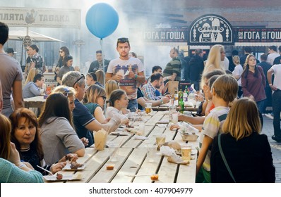 KYIV, UKRAINE - APR 17: Big Table Of Outdoor Restaurant With Eating And Drinking People During Popular Street Food Festival On April 17, 2016. Kiev Is The 8th Most Populous City In Europe.