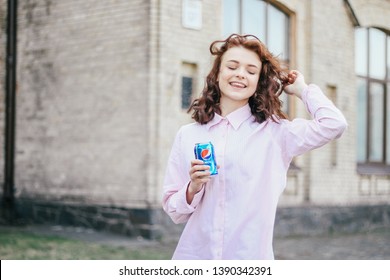 KYIV, UKRAINE - APRIL 04, 2019:Happy Girl Drink Pepsi 