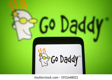 KYIV, UKRAINE - APRIL 07, 2021: In this photo illustration GoDaddy Inc. logo is seen on a mobile phone and a computer screen.
