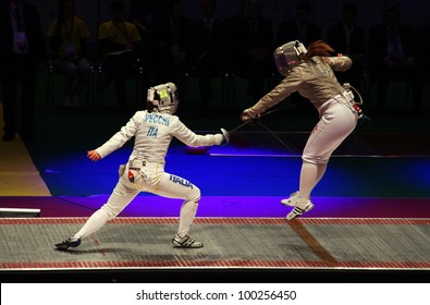 KYIV, UKRAINE - APRIL 13: Irene Vecchi (Italy) Fights Against Dagmara Wozniak (USA) During Women's Sabre Team Match Of The World Fencing Championships On April 13, 2012 In Kyiv, Ukraine