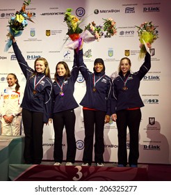 KYIV, UKRAINE - APRIL 13,2012: USA National Sabre Team - The Bronze Medalists Of The World Fencing Championships. From Left To Right: Dagmara Wozniak, Daria Schneider, Ibtihaj Muhhamad, Mariel Zagunis