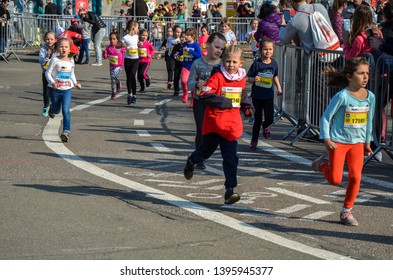 KYIV, UKRAINE - APRIL 6, 2019: 9th Nova Poshta Halfmarathon. Junior Female Athletics Runner.  Running Race Competition. Outdoor Circuit. Horizontal