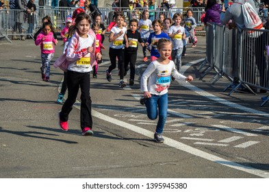 KYIV, UKRAINE - APRIL 6, 2019: 9th Nova Poshta Halfmarathon. Junior Female Athletics Runner.  Running Race Competition. Outdoor Circuit. Horizontal