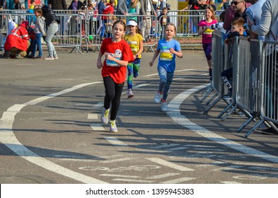 KYIV, UKRAINE - APRIL 6, 2019: 9th Nova Poshta Halfmarathon. Junior Female Athletics Runner.  Running Race Competition. Outdoor Circuit. Horizontal