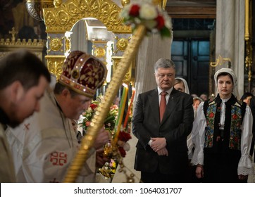 KYIV, UKRAINE- April 8, 2018: Ukrainian President Petro Poroshenko, centre, and his wife Maryna Poroshenko, right, attends an Orthodox Easter service in St. Volodymyr Cathedral
