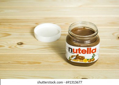 Kyiv, Ukraine - Aug 5th, 2017: Jar Of Nutella Hazelnut. Opened Jar With A Nutella On A Wooden Background.