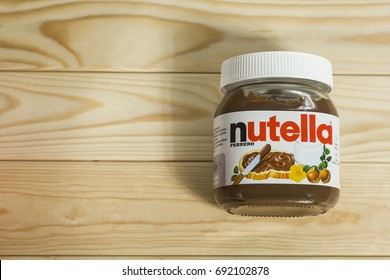 Kyiv, Ukraine - Aug 5th, 2017: Jar Of Nutella Hazelnut. Jar With A Cream Of Nutella On Wooden Background. 