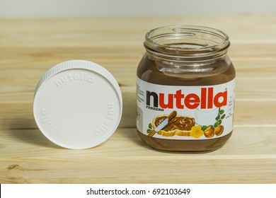 Kyiv, Ukraine - Aug 5th, 2017: Jar Of Nutella Hazelnut. Jar With A Cream Of Nutella On Wooden Background. 