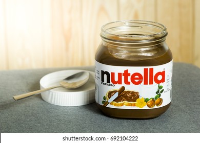 Kyiv, Ukraine - Aug 5th, 2017: Jar Of Nutella Hazelnut. Jar With A Cream Of Nutella On Wooden Background. 