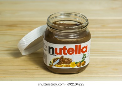 Kyiv, Ukraine - Aug 5th, 2017: Jar Of Nutella Hazelnut. Jar With A Cream Of Nutella On Wooden Background. 