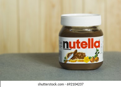 Kyiv, Ukraine - Aug 5th, 2017: Jar Of Nutella Hazelnut. Jar With A Cream Of Nutella On Wooden Background. 