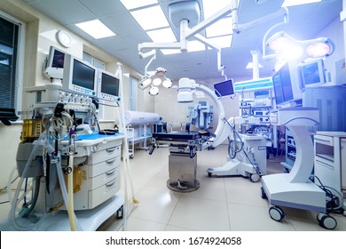 KYIV, UKRAINE - August 2019: Clinic interior with operating surgery table, lamps and ultra modern devices, technology, hi-tech interior, medicine concept