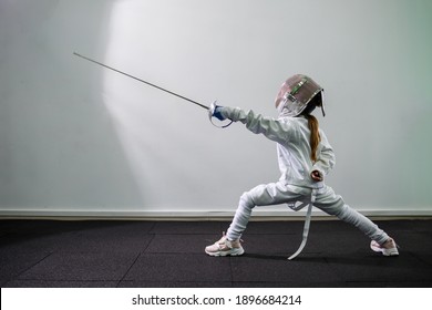 KYIV, UKRAINE - August 2020: Children lunge on swords. A child in a class at a fencing school