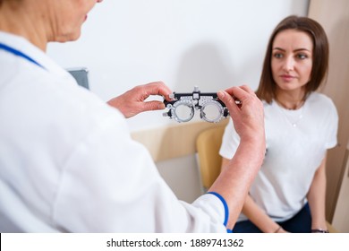 KYIV, UKRAINE - August 2020: Young Beautiful Woman At The Ophthalmologist's Appointment Checks Her Eyesight. Doctor Ophthalmologist Examines The Patient