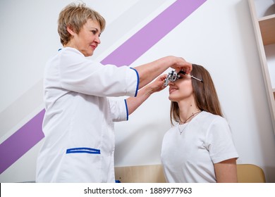 KYIV, UKRAINE - August 2020: Young Beautiful Woman At The Ophthalmologist's Appointment Checks Her Eyesight. Doctor Ophthalmologist Examines The Patient