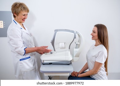 KYIV, UKRAINE - August 2020: Young Beautiful Woman At The Ophthalmologist's Appointment Checks Her Eyesight. Doctor Ophthalmologist Examines The Patient