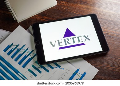 KYIV, UKRAINE - August 21, 2021. Papers With Charts And Vertex Pharmaceuticals Company Logo.