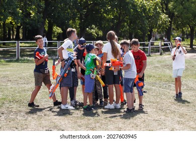 Kyiv, Ukraine - August 24, 2019:    Kids with NERF guns in park outdoor
