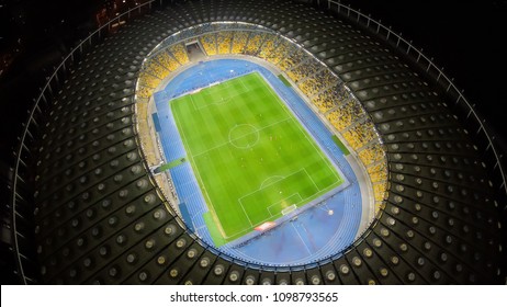 KYIV, UKRAINE - CIRCA APRIL 2018: Olympiysky Sports Complex. Great Illuminated Stadium From Aerial Perspective, Football Game, Championship
