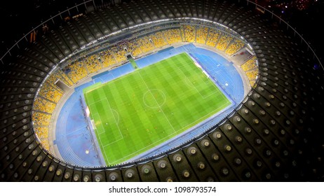 KYIV, UKRAINE - CIRCA APRIL 2018: Olympiysky Sports Complex. Panorama Of Beautiful Stadium At Night, Footballers Play Match, Sport Event
