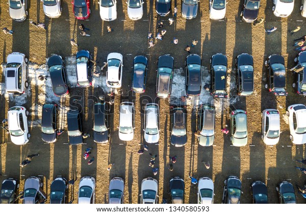 Kyiv, Ukraine -\
December 25, 2018: Aerial drone image of many cars parked on car\
market or parking lot, top\
view.