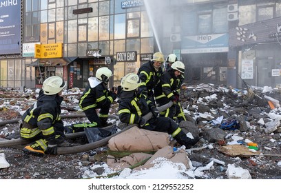 KYIV, UKRAINE - Feb. 25, 2022: War of Russia against Ukraine. Rescue service works near a house destroyed by russian rocket in Kyiv