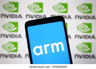 KYIV, UKRAINE - FEBRUARY 15, 2021: In This Photo Illustration ARM And Nvidia Logos Are Displayed On A Mobile Phone Screen And A Monitor. 