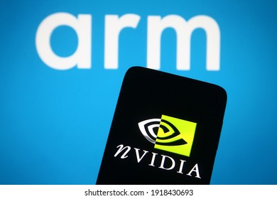 KYIV, UKRAINE - FEBRUARY 15, 2021: In This Photo Illustration ARM And Nvidia Logos Are Displayed On A Mobile Phone Screen And A Monitor. 