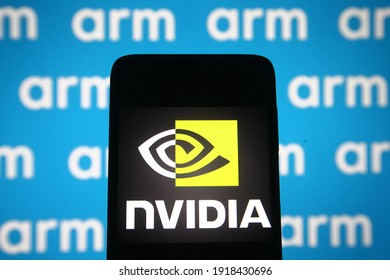 KYIV, UKRAINE - FEBRUARY 15, 2021: In This Photo Illustration ARM And Nvidia Logos Are Displayed On A Mobile Phone Screen And A Monitor. 