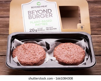 Kyiv, Ukraine - February 19 2020: Package And Content Of Beyond Meat Beyond Burgers On Wooden Background