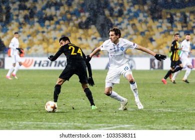 Kyiv, Ukraine - February 22, 2018: Denys Garmash Of Dynamo Kyiv Fighting For The Ball With Masoud Shojaei Of AEK During UEFA Europa League Match At NSC Olimpiyskiy Stadium.