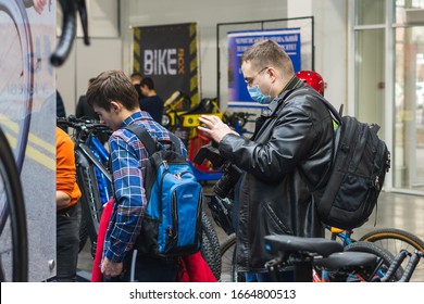 Kyiv, Ukraine, February 28, 2020: A Man With A Mask On His Face To Prevent Coronavirus Disease In The Bike Shop.