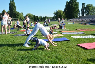 KYIV, UKRAINE - January, 09, 2019: Yoga Classes Outside On The Open Air. Kids Yoga, Children's Yoga, Family Yoga, Mom And Son.