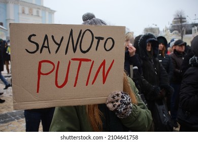 Kyiv, Ukraine - January 10, 2022: girl with political banner Say no to Putin at winter street protest rally. Reportageeditorial photo.