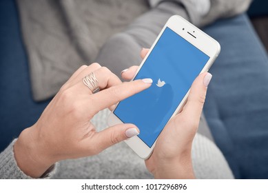 Kyiv, Ukraine - January 24, 2018: Female Holding Apple Iphone 8 plus On Hand And Start Using Twitter Application.