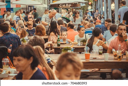 KYIV, UKRAINE - JUL 23: Crowd Of Hungry People Eating Meals Around Tables Outdoor During Street Food Festival On July 23, 2016. Kiev Is The 8th Most Populous City In Europe.