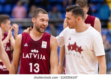 KYIV, UKRAINE - JULY 1, 2018: MVP Janis Strelnieks and Dairis Bertans happy victory emotions. Close-up portraits, smiles and glory. FIBA World Cup 2019 European Qualifiers match Ukraine-Latvia