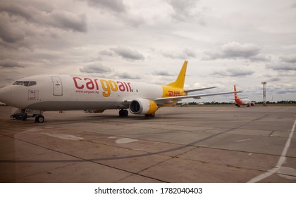 Kyiv, Ukraine - July 14, 2020: Cargo DHL plane LZ-CGT BOEING 737-400F. Yellow airplane on the platform of Boryspil International Airport. AIRLINE Cargo Air. Runway. Landing aircraft