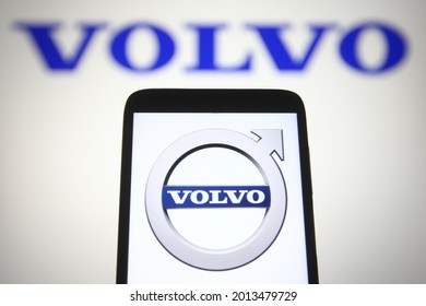 KYIV, UKRAINE - JULY 24, 2021: In this photo illustration Volvo Car Corporation logo is seen on a mobile phone and a computer screen.