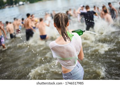 KYIV, UKRAINE - JUNE 19: During The Summer Heat Near Three Hundred Youth People Staged A Water Battle In The Center Of Kyiv On The Venetian Island Near The River Of Dnieper.