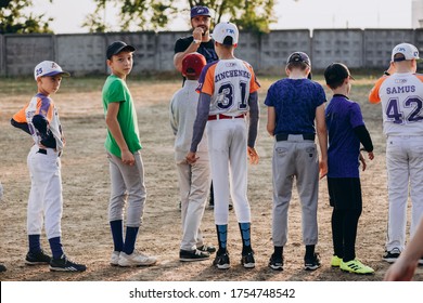 Kyiv, Ukraine - June 3, 2020: Little League Field, Youth Baseball, Spring, Coach Talking To Players