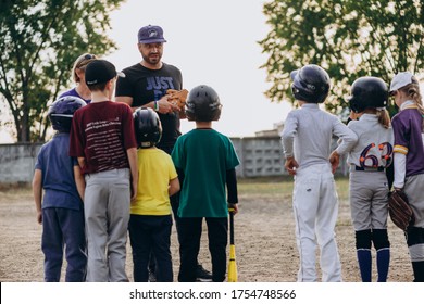 Kyiv, Ukraine - June 3, 2020: A baseball coach talks to his students about how to play properly