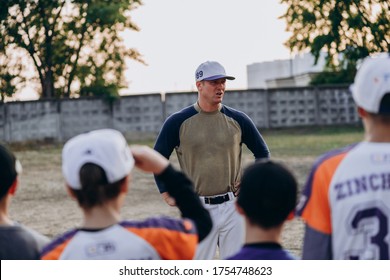 Kyiv, Ukraine - June 3, 2020: A Serious Coach Communicates With His Students Outdoors