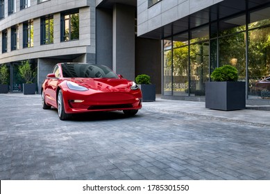 Kyiv, Ukraine - June 7, 2020: Red Tesla Model 3 In City