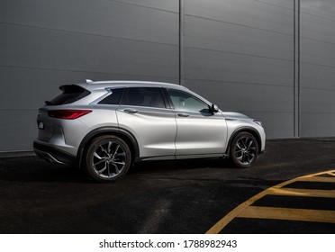 Kyiv, Ukraine - June 9, 2020: Automotive Photography - Silver Infiniti QX50 On Parking Lot Near Gray Wall Of Office Building