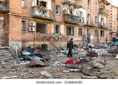 KYIV, UKRAINE - Mar. 18, 2022: War in Ukraine. Damaged residential buildings in the aftermath of a shelling in Podilskyi district of Kyiv. At least one person was reportedly killed and 19 were injured
