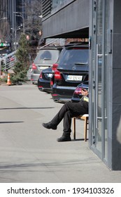 Kyiv, Ukraine - March 11 2021: Legs Of A Parking Lot Attendant