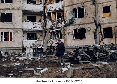 Kyiv, Ukraine - March 20, 2022: War of Russia against Ukraine. A residential building damaged by an enemy aircraft in the Ukrainian capital Kyiv. The press is working