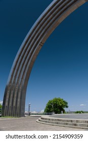 Kyiv, Ukraine - May 10, 2022: Half Of Arch Of Friendship Of Peoples In Kyiv Against Clear Blue Sky. Copy Space.